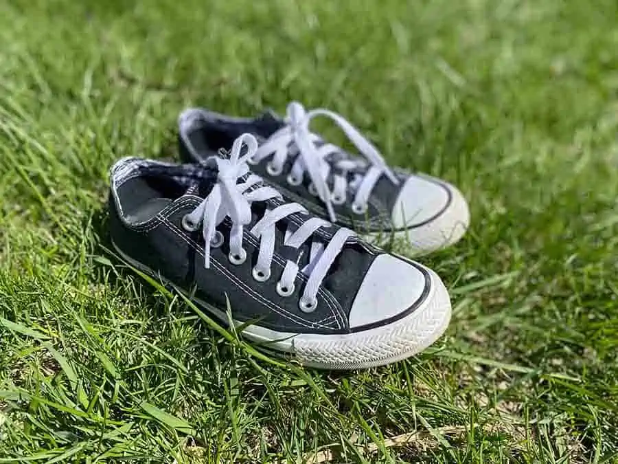 Black converse in the grass