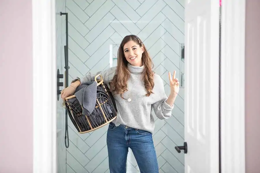 Melissa Maker holding a laundry basket