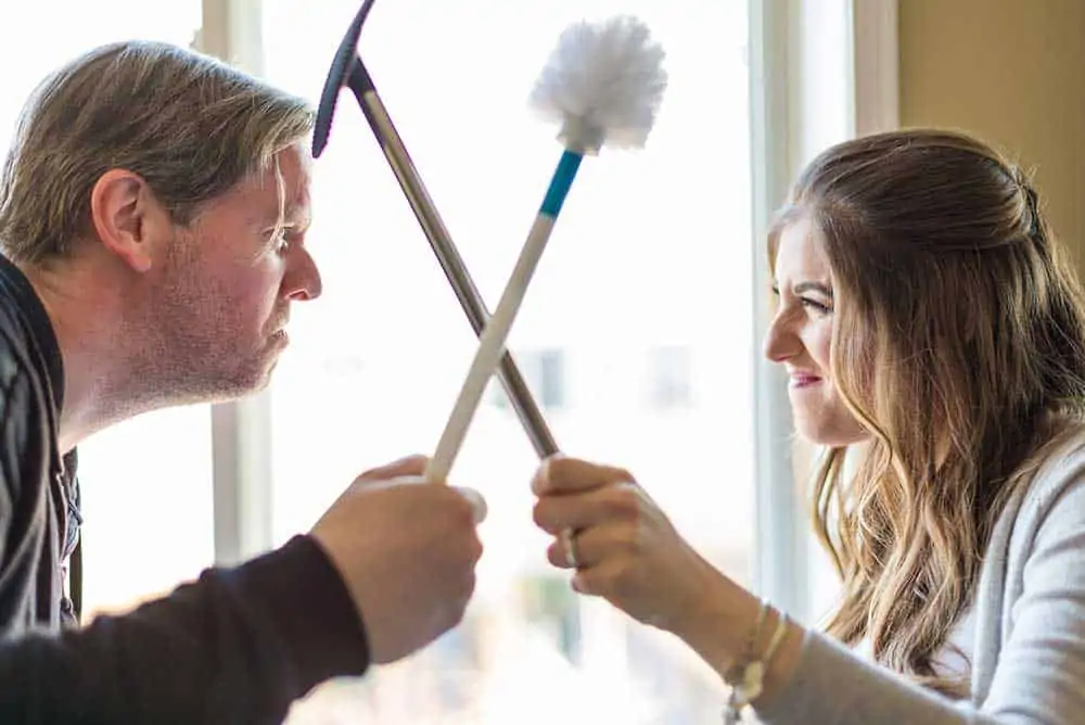 Melissa and Chad Holding Toilet Brushes