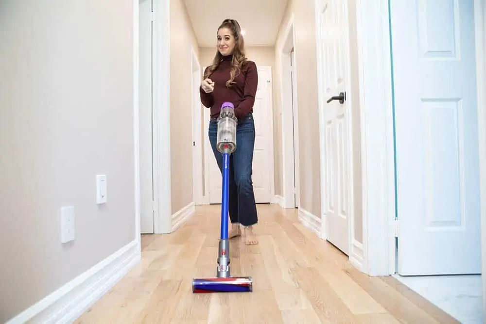 Melissa vacuuming her hallway