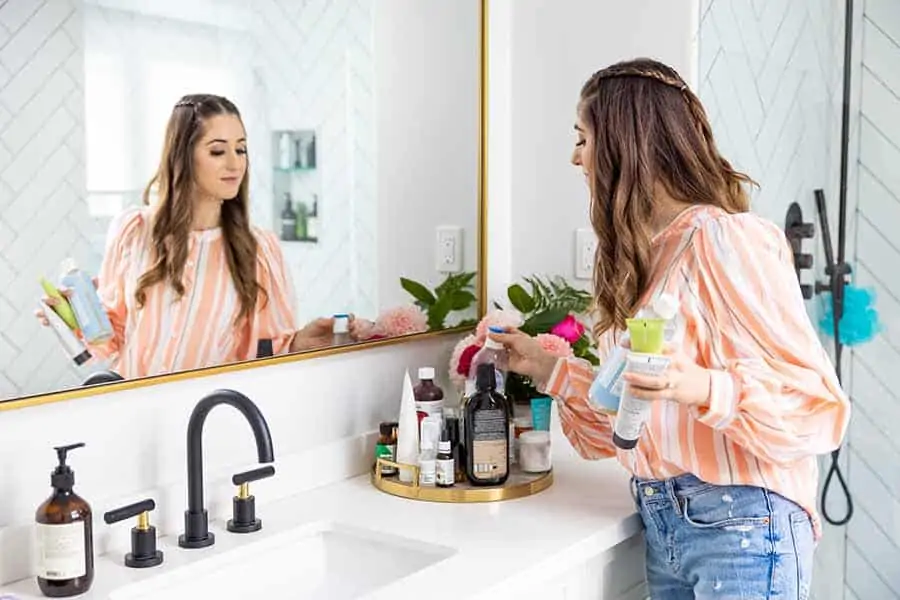 Melissa Maker cleaning the bathroom