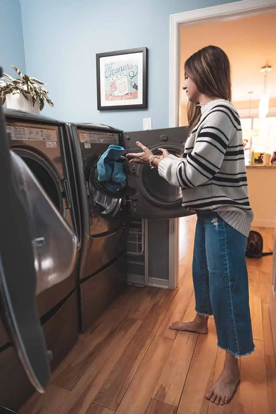 Melissa Maker loading laundry machine