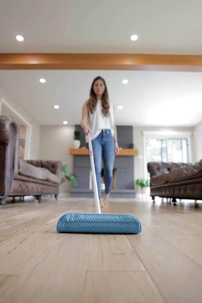 Melissa Maker mopping the floor